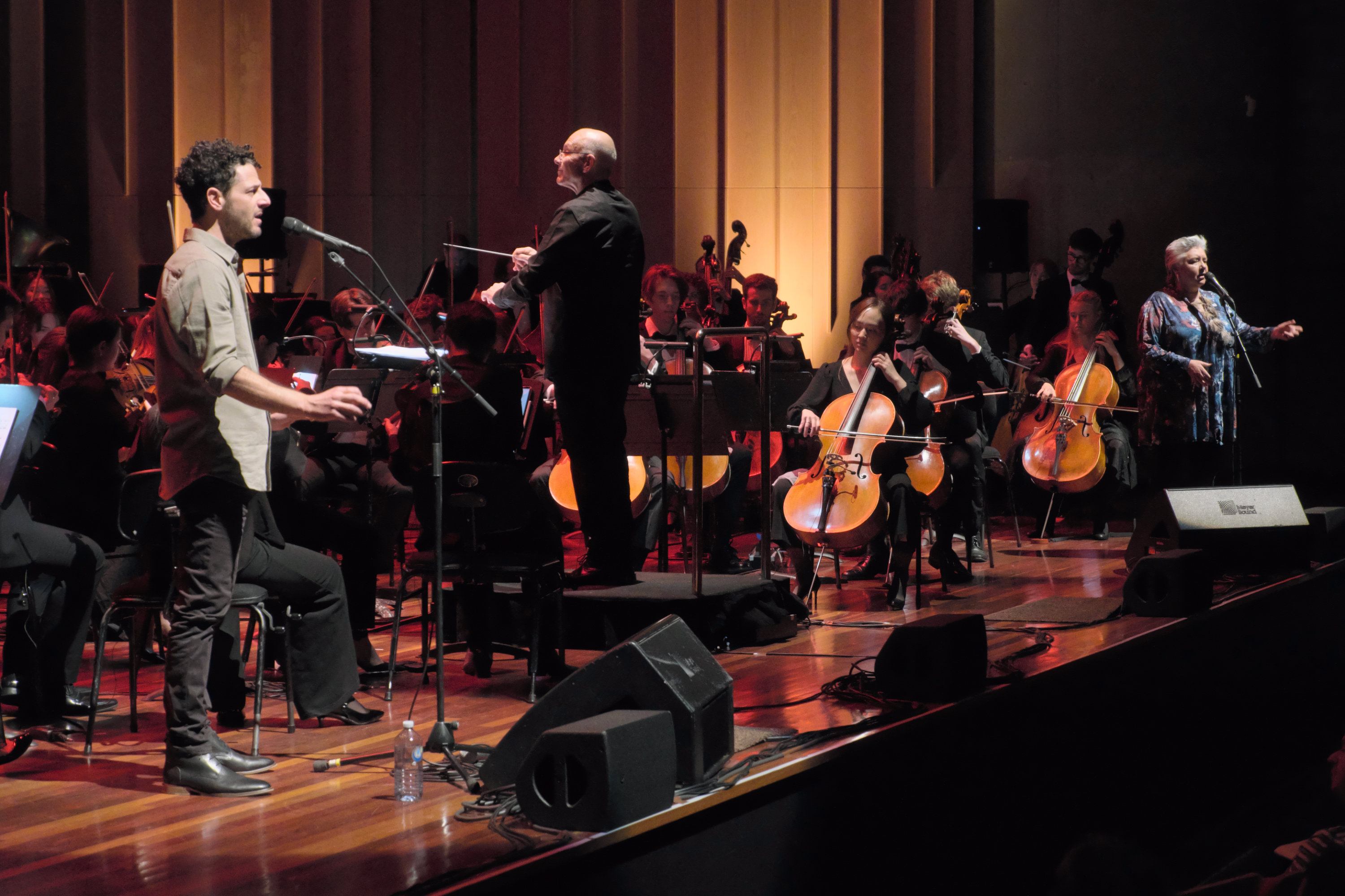 Composer Nigel Westlake, singer-songwriter Lior, and performer and academic Dr Lou Bennett AM performing their composition 'Ngapa William Cooper' at Llewellyn Hall as part of AYO Canberra Music Camp, 2023. Credit Peter Hislop.