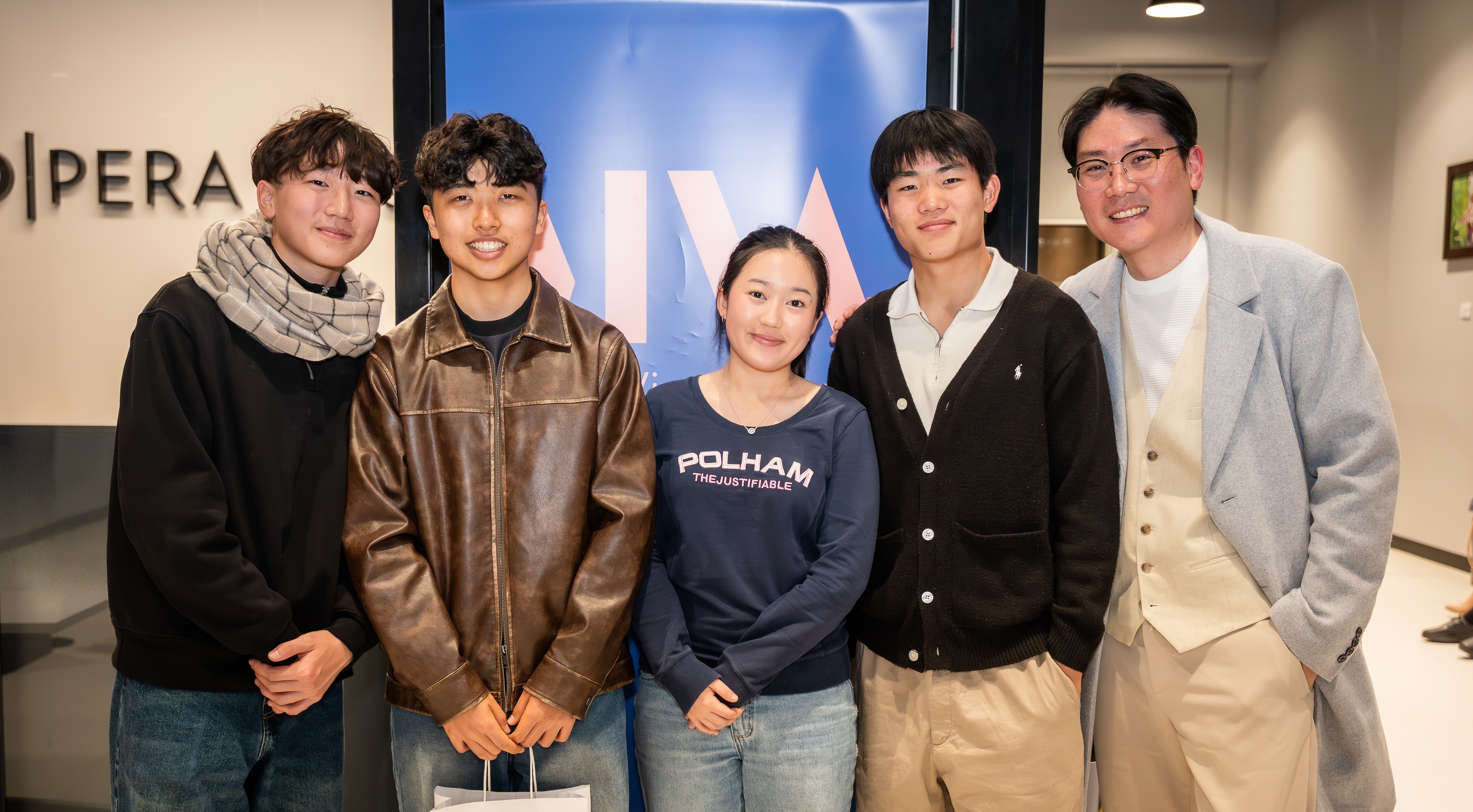 Tim Li (right) with the Incredibows, winners of Strike A Chord 2025. © Matthew Chen