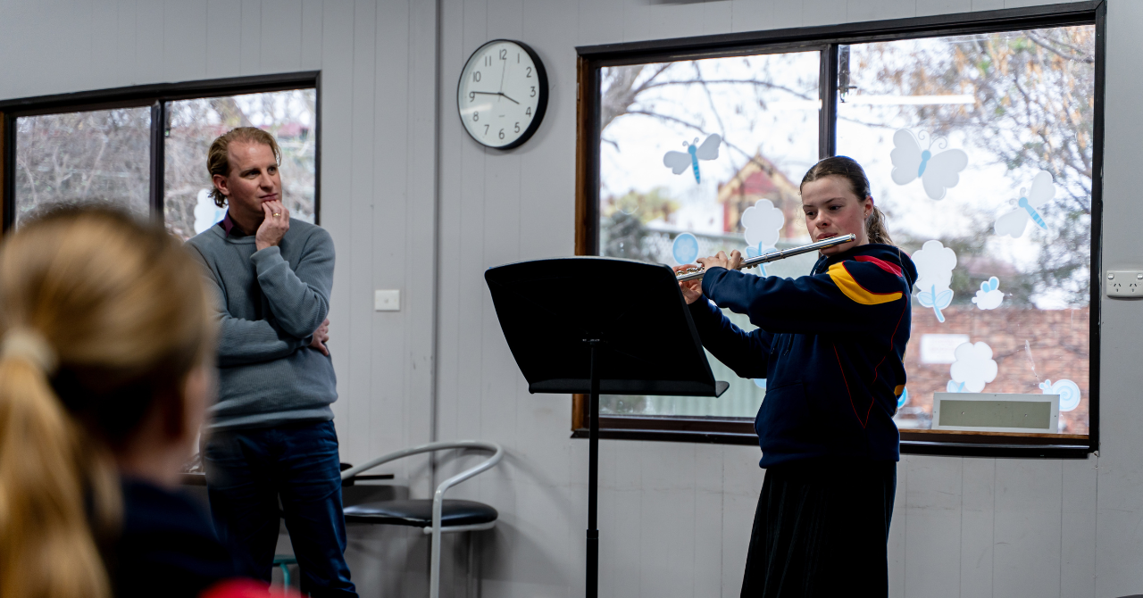 Professional trumpeter and performance mentor Mark Bain guides a young flautist in preparation for their HSC music exam, offering expert insight and support. Photo credit: James Buchanan